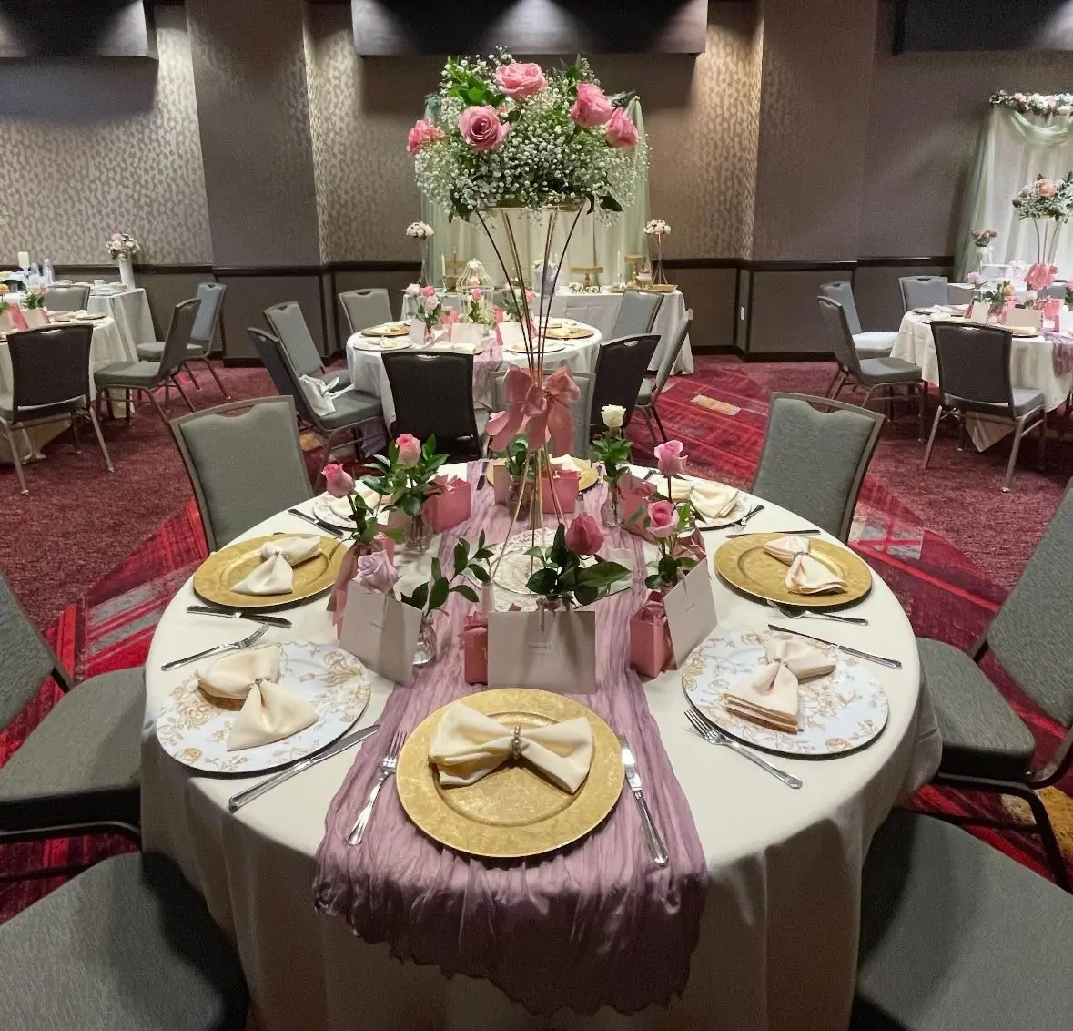 Tall pink rose centerpiece on a reception table, event flowers Tucson