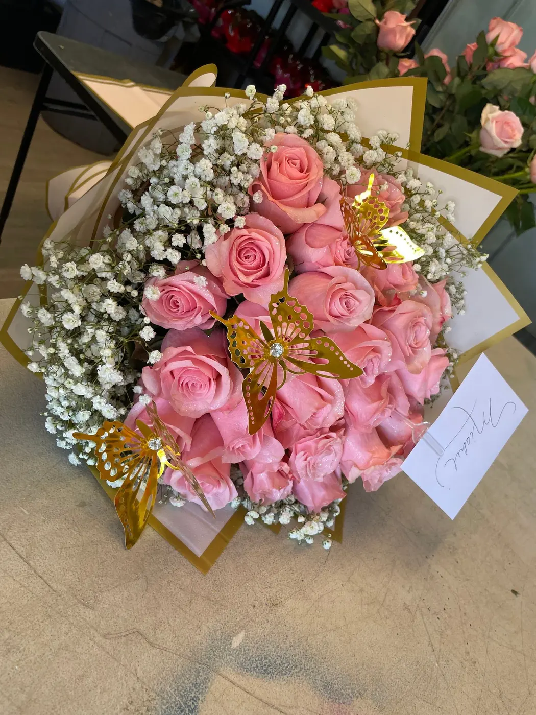 Pink roses and baby’s breath bouquet by Wholesale Flowers by Keystone Trading, Tucson AZ
